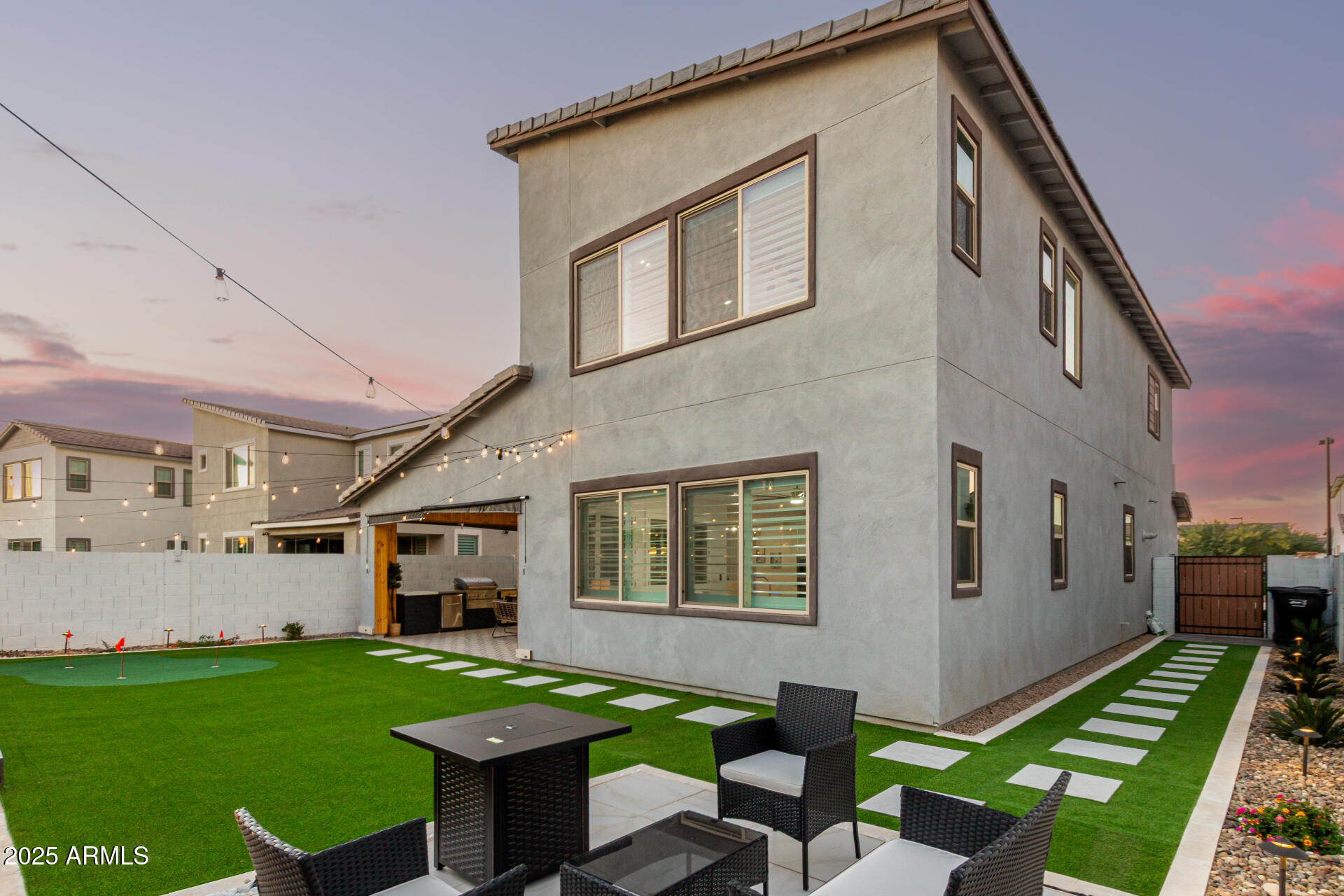1501 East Rakestraw Lane Gilbert, AZ 85298 - Photo 47 of 71 a backyard of a house with table and chairs