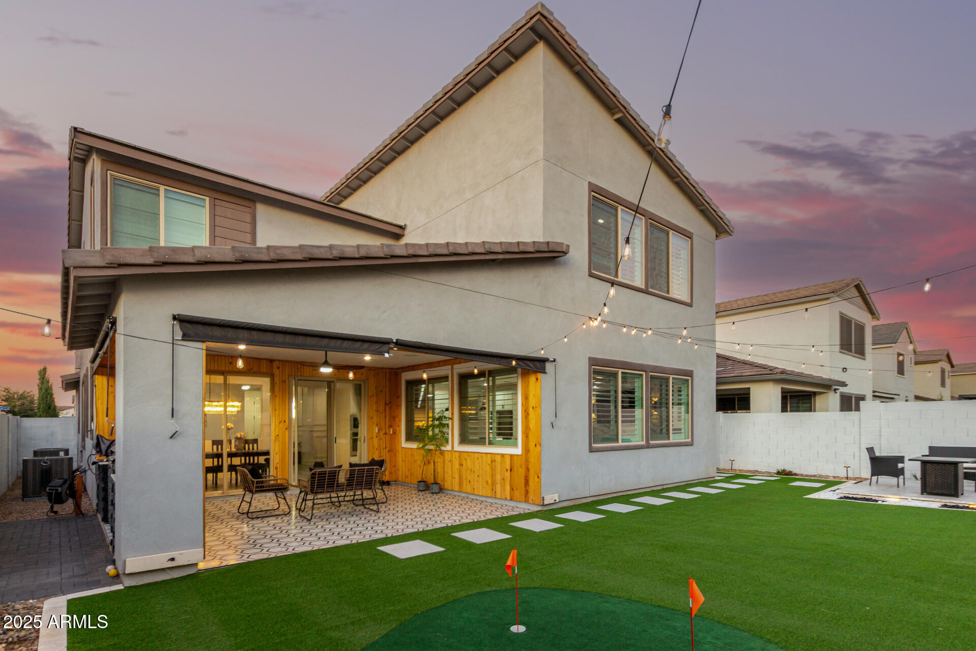 1501 East Rakestraw Lane Gilbert, AZ 85298 - Photo 48 of 71 a front view of the house with yard and outdoor seating