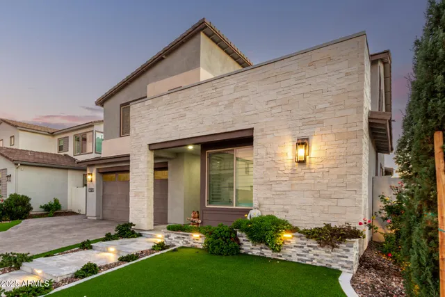 front view of a house with a yard
