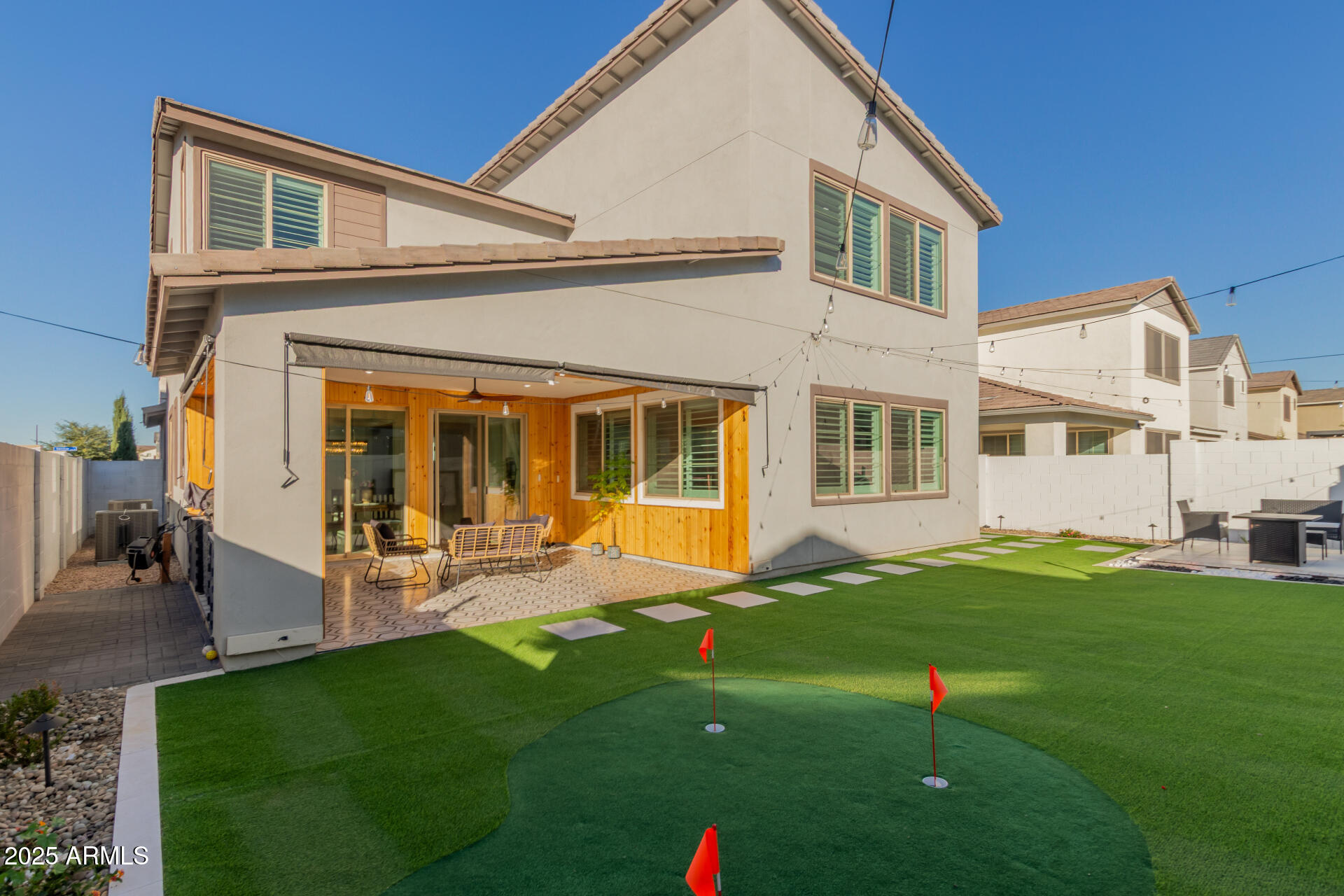 1501 East Rakestraw Lane Gilbert, AZ 85298 - Photo 53 of 71 a front view of a house with a yard and porch