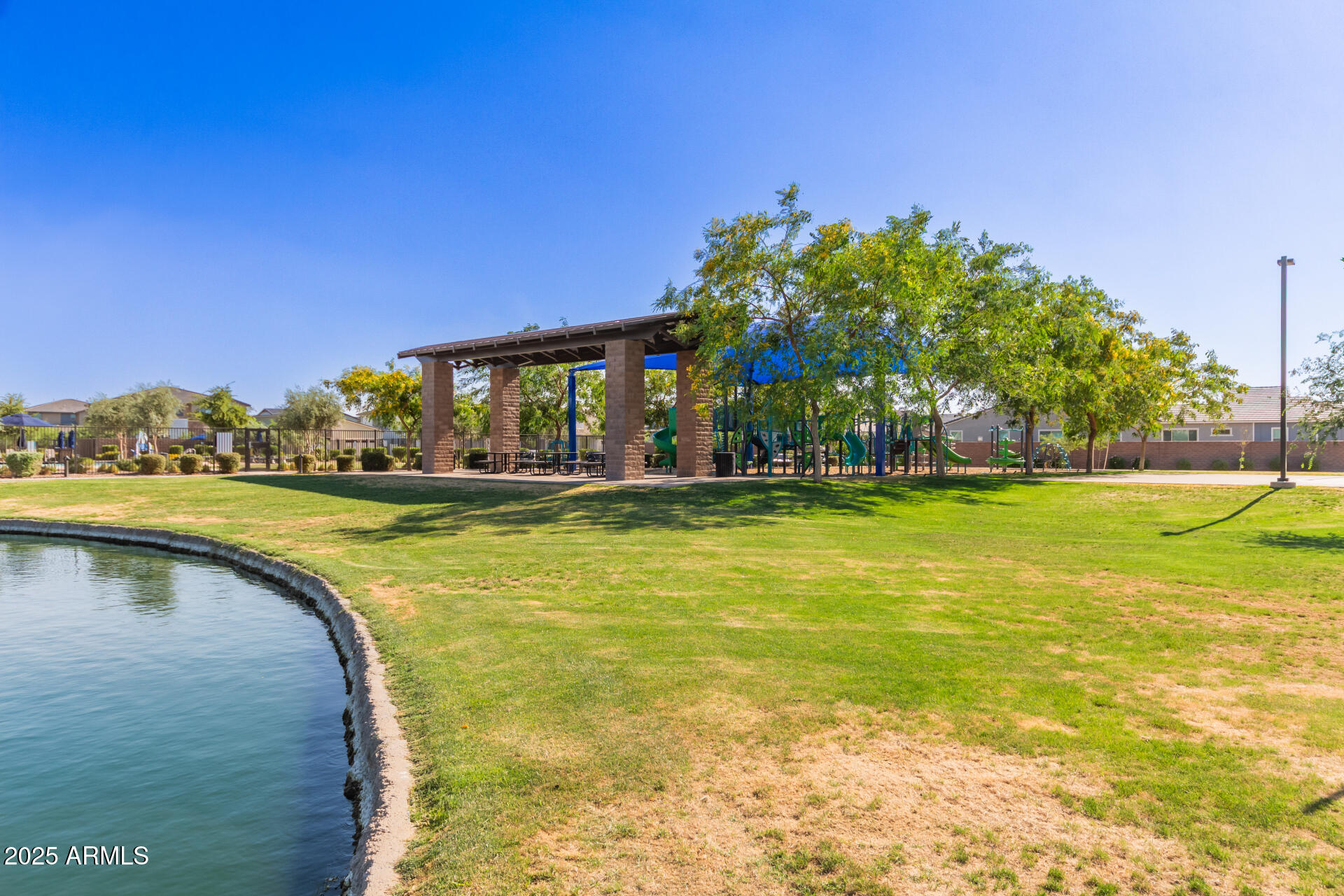 1501 East Rakestraw Lane Gilbert, AZ 85298 - Photo 64 of 71 a view of swimming pool with outdoor seating and lake view