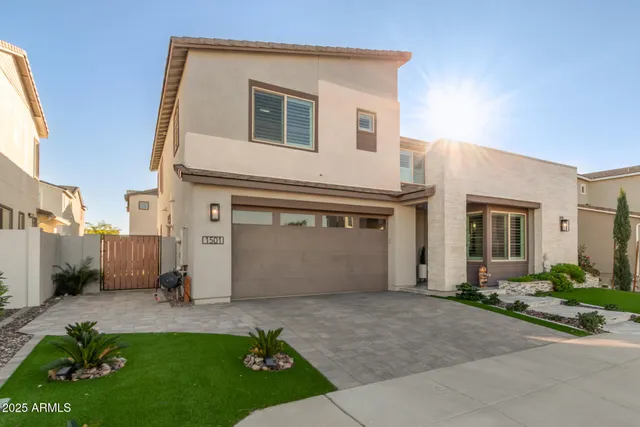 a view of a hallway with wooden floor and a potted plant