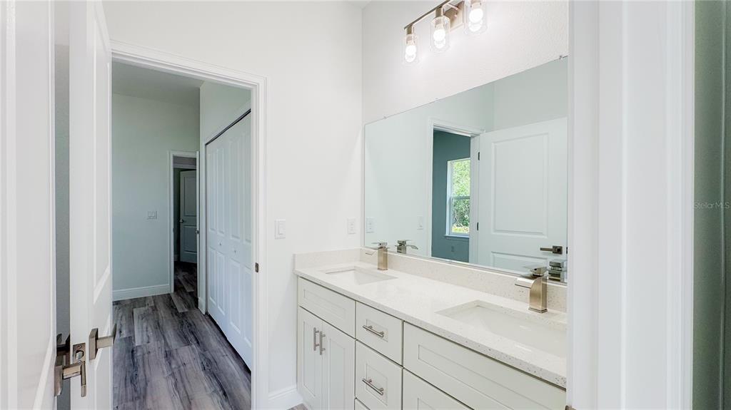 15625 Southwest 37th Circle Ocala, FL 34473 - Photo 15 of 27 a bathroom with a sink and a mirror