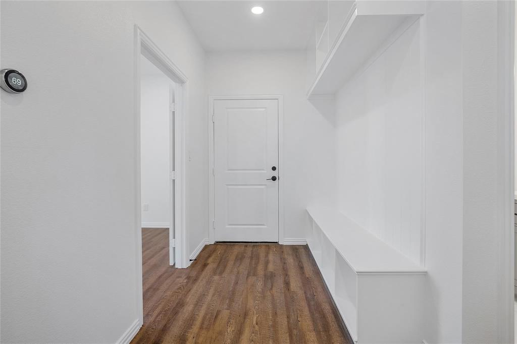 3093 Willow Road Celeste, TX 75423 - Photo 26 of 40 a view of a hallway with wooden floor and staircase