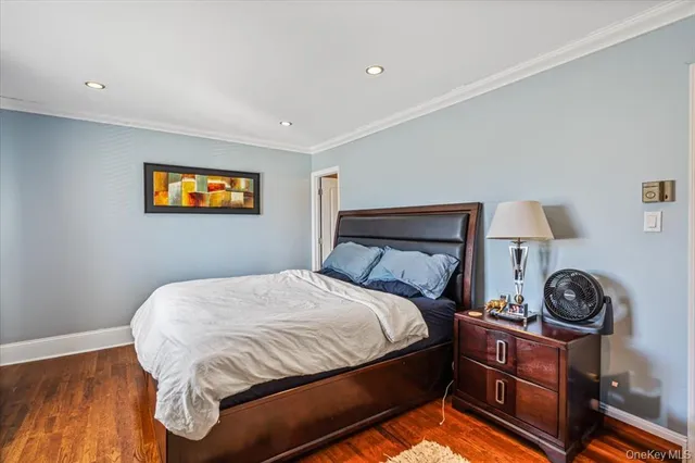 a large bed sitting in a bedroom and a table