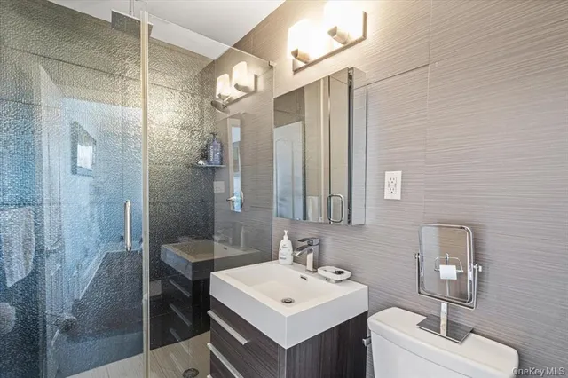 a bedroom with bed and a chandelier