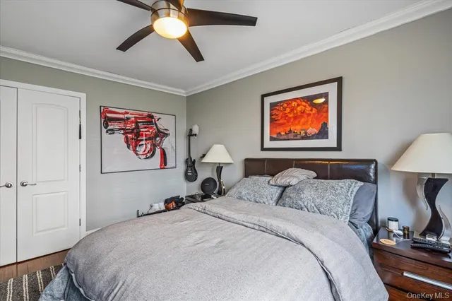 a bedroom with bed and a chandelier