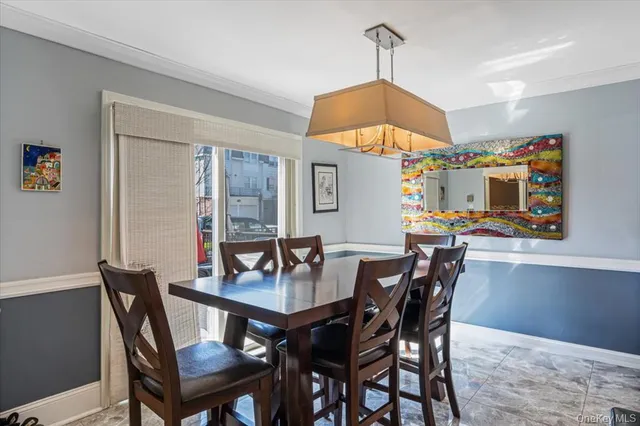 a kitchen with a dining table and chairs