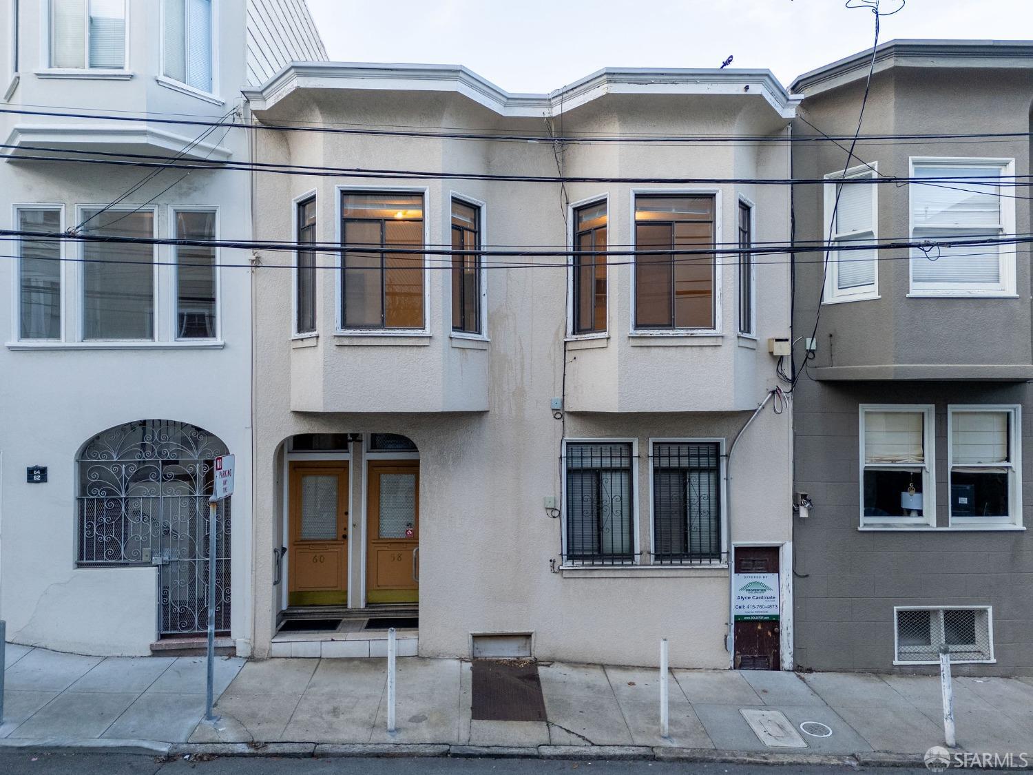 58-60 Valparaiso Street, Unit 2 San Francisco, CA 94133 - Photo 61 of 79 a front view of a house with many windows