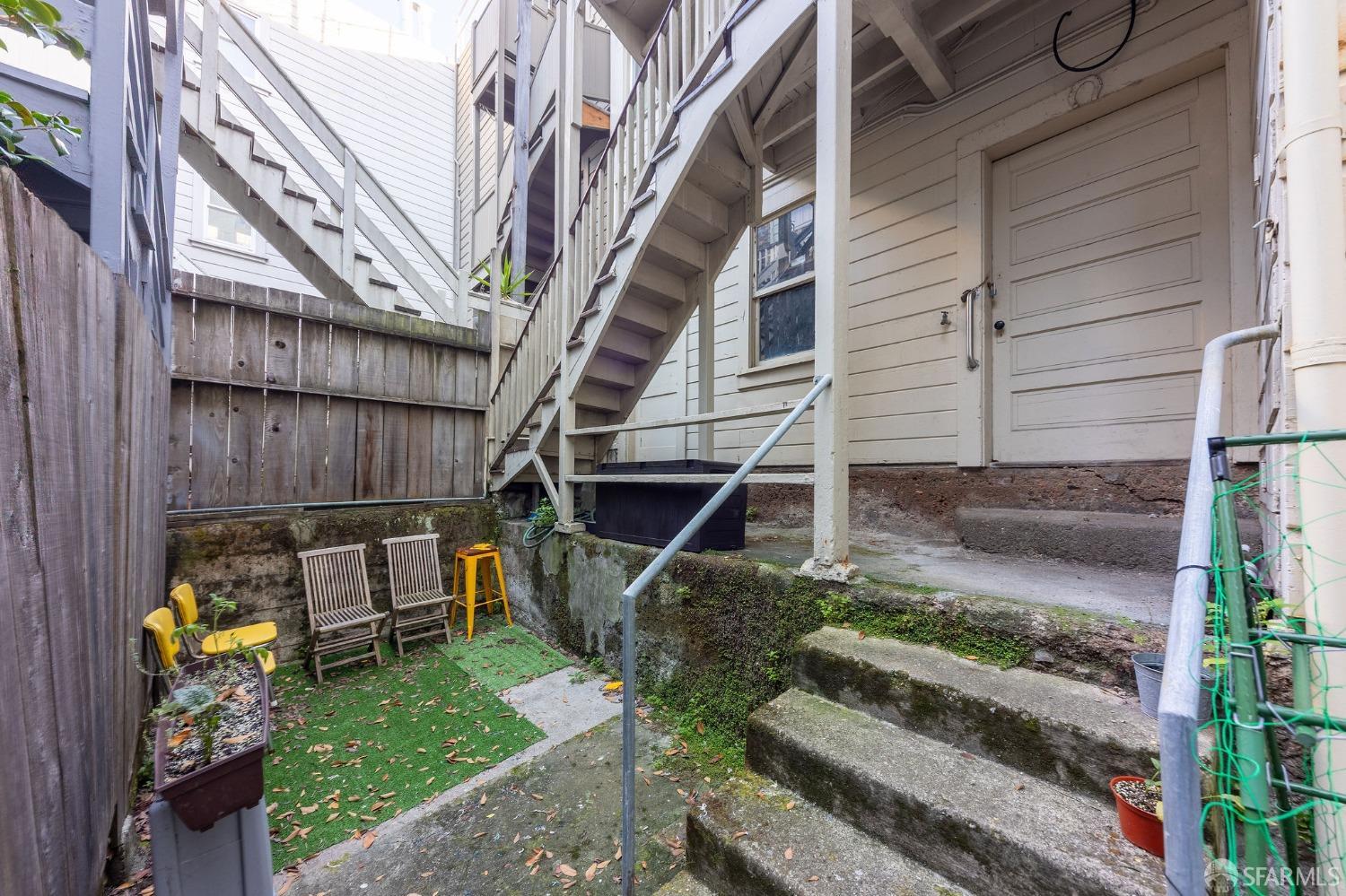 58-60 Valparaiso Street, Unit 2 San Francisco, CA 94133 - Photo 67 of 79 a view of a house with backyard and wooden stairs
