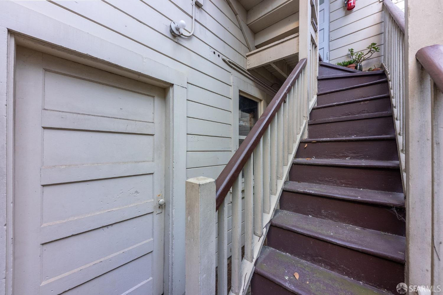 58-60 Valparaiso Street, Unit 2 San Francisco, CA 94133 - Photo 72 of 79 a view of staircase with white walls and a window