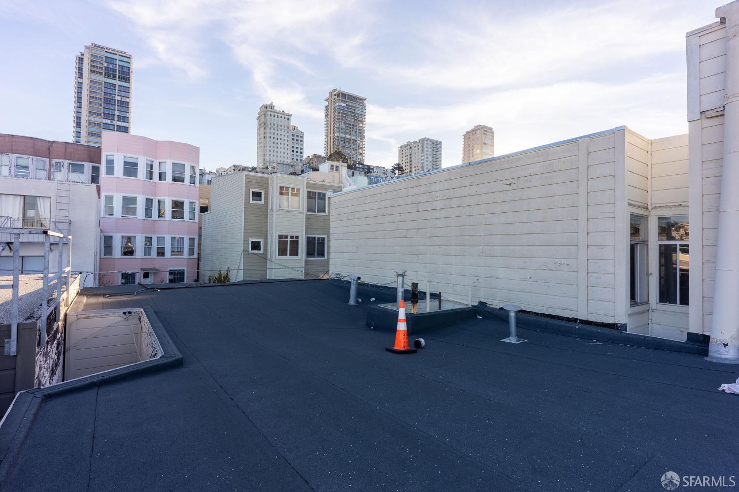 58-60 Valparaiso Street, Unit 2 San Francisco, CA 94133 - Photo 75 of 79 a view of a terrace with buildings