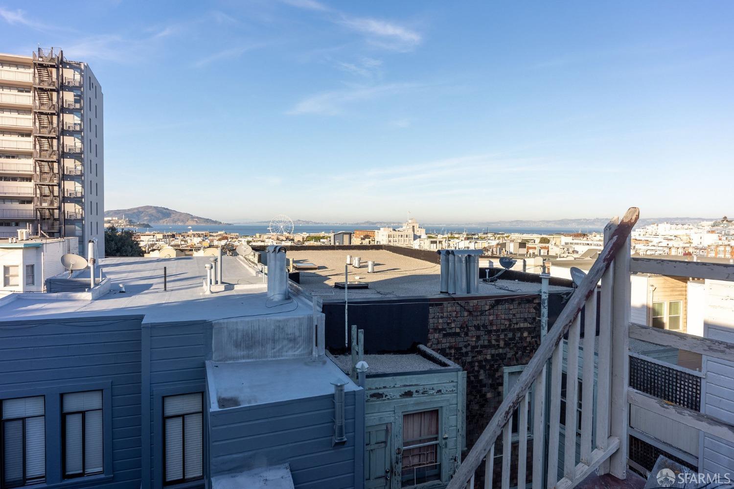 58-60 Valparaiso Street, Unit 2 San Francisco, CA 94133 - Photo 76 of 79 a view of a balcony with furniture and wooden floor