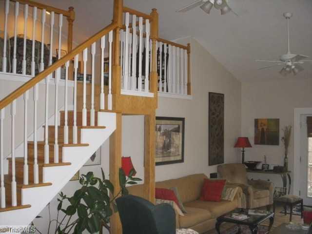 1951 Tillotson Road Pinnacle, NC 27043 - Photo 7 of 16 Den/Family/Great Room. This is the other end of the Family Room. Notice the steps that go up to a balcony. The balcony ares is being used for an office.
