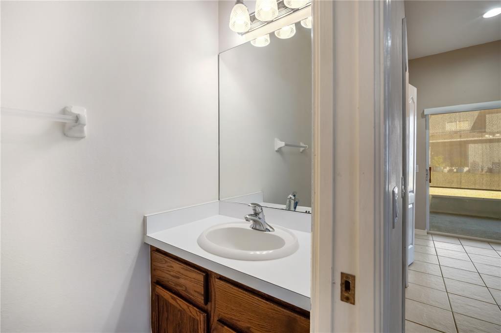 6754 Lake Rochester Lane Gibsonton, FL 33534 - Photo 11 of 26 a sink and a mirror