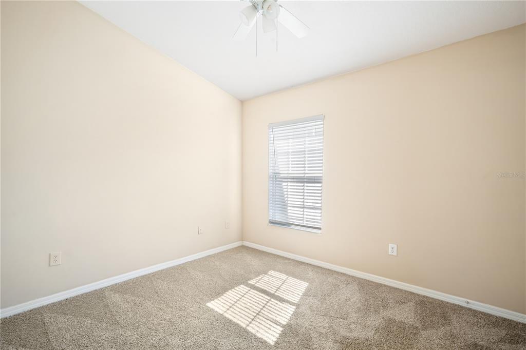 6754 Lake Rochester Lane Gibsonton, FL 33534 - Photo 12 of 26 an empty room with windows