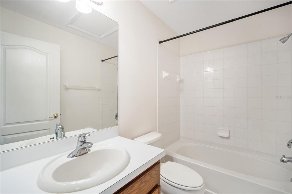 6754 Lake Rochester Lane Gibsonton, FL 33534 - Photo 14 of 26 a bathroom with a sink toilet and shower