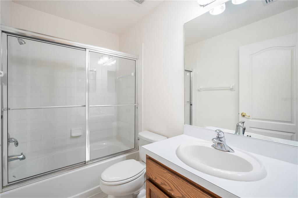 6754 Lake Rochester Lane Gibsonton, FL 33534 - Photo 17 of 26 a bathroom with a sink toilet and shower