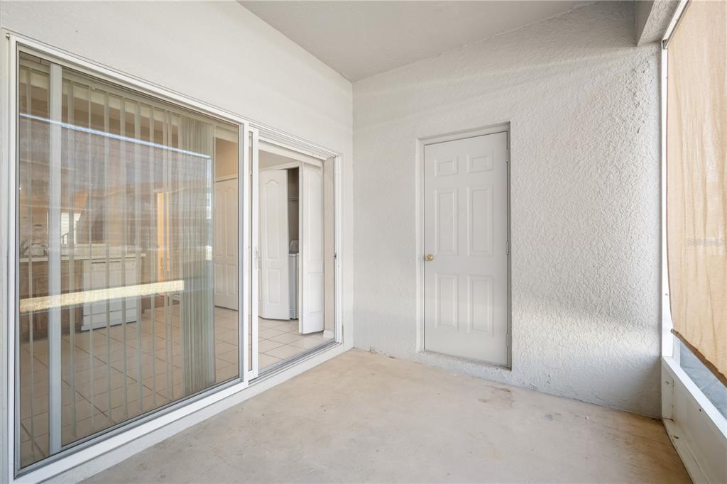 6754 Lake Rochester Lane Gibsonton, FL 33534 - Photo 19 of 26 an empty room with sliding glass door