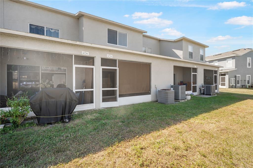 6754 Lake Rochester Lane Gibsonton, FL 33534 - Photo 20 of 26 a view of a house with backyard and porch