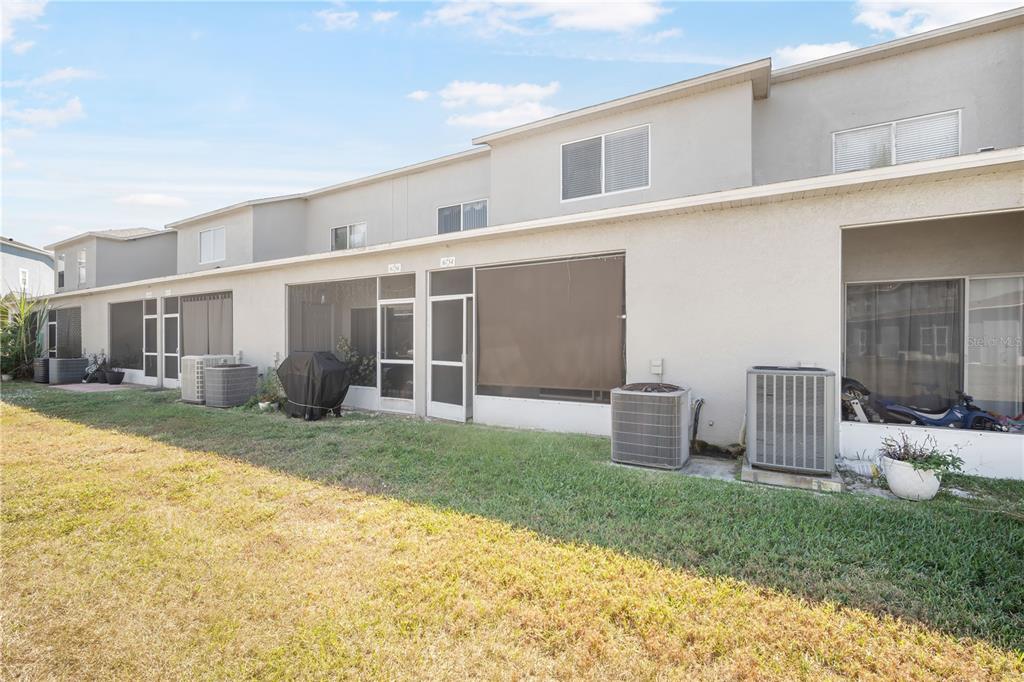 6754 Lake Rochester Lane Gibsonton, FL 33534 - Photo 21 of 26 a view of a house with backyard and sitting area