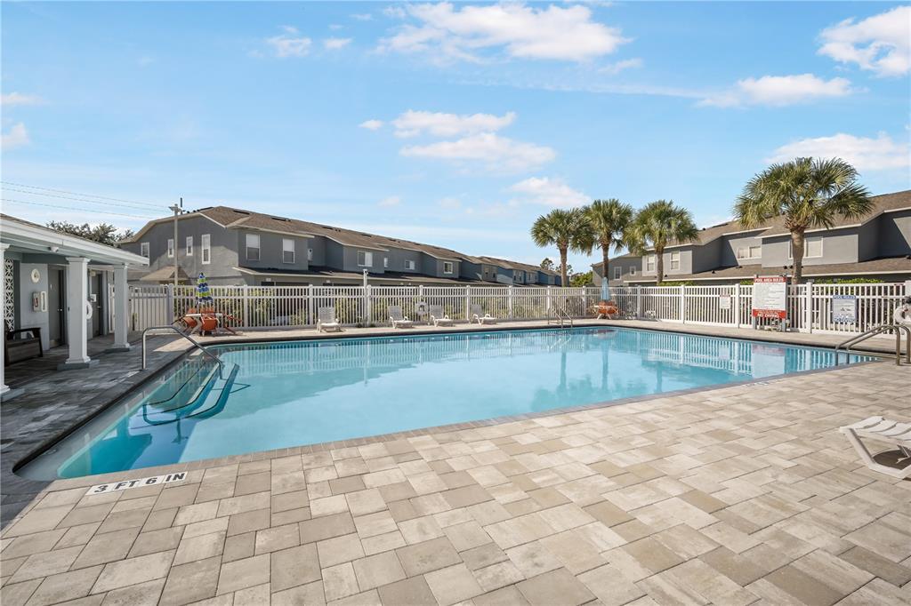 6754 Lake Rochester Lane Gibsonton, FL 33534 - Photo 23 of 26 a view of a swimming pool with a yard