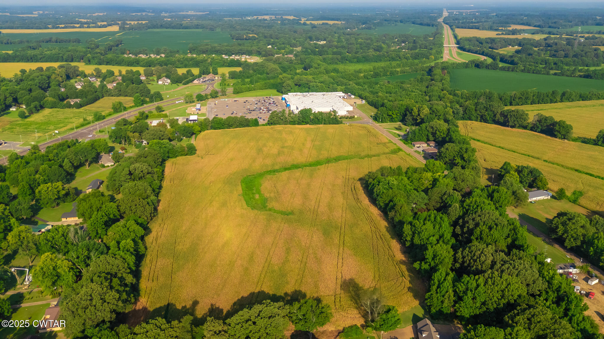 137 Courtright Road Martin, TN 38237 - Photo 6 of 17 a view of a lake with a building in the background