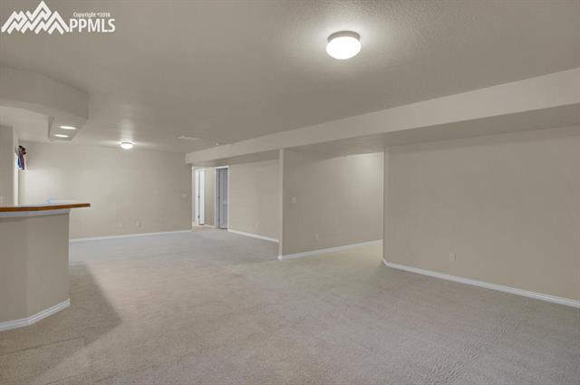 9162 Rockingham Drive Peyton, CO 80831 - Photo 23 of 35 Lower level rec room.