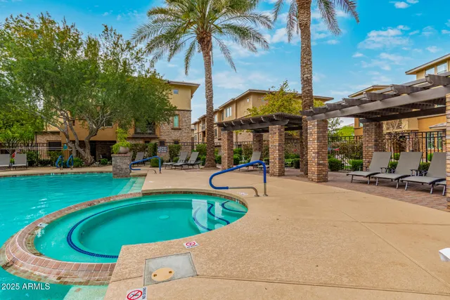 a view of a swimming pool with a patio