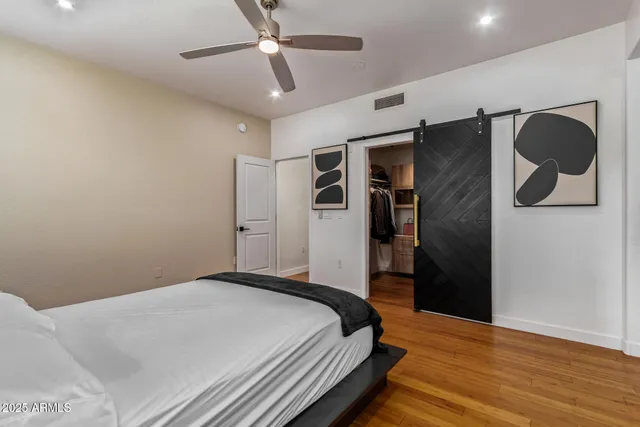 a bedroom with a bed and a walk in closet