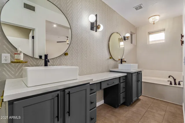 a bathroom with a double vanity sink and a mirror