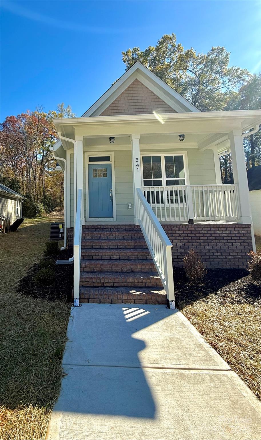 a view of a house with a yard