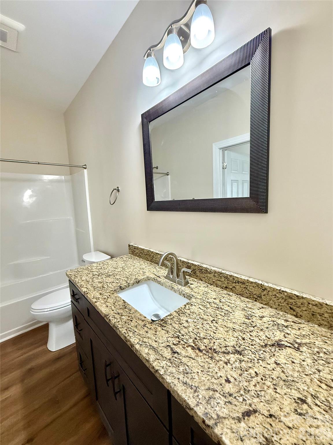 341 Broad Drive Southwest Concord, NC 28025 - Photo 11 of 16 a bathroom with a granite countertop sink and a mirror