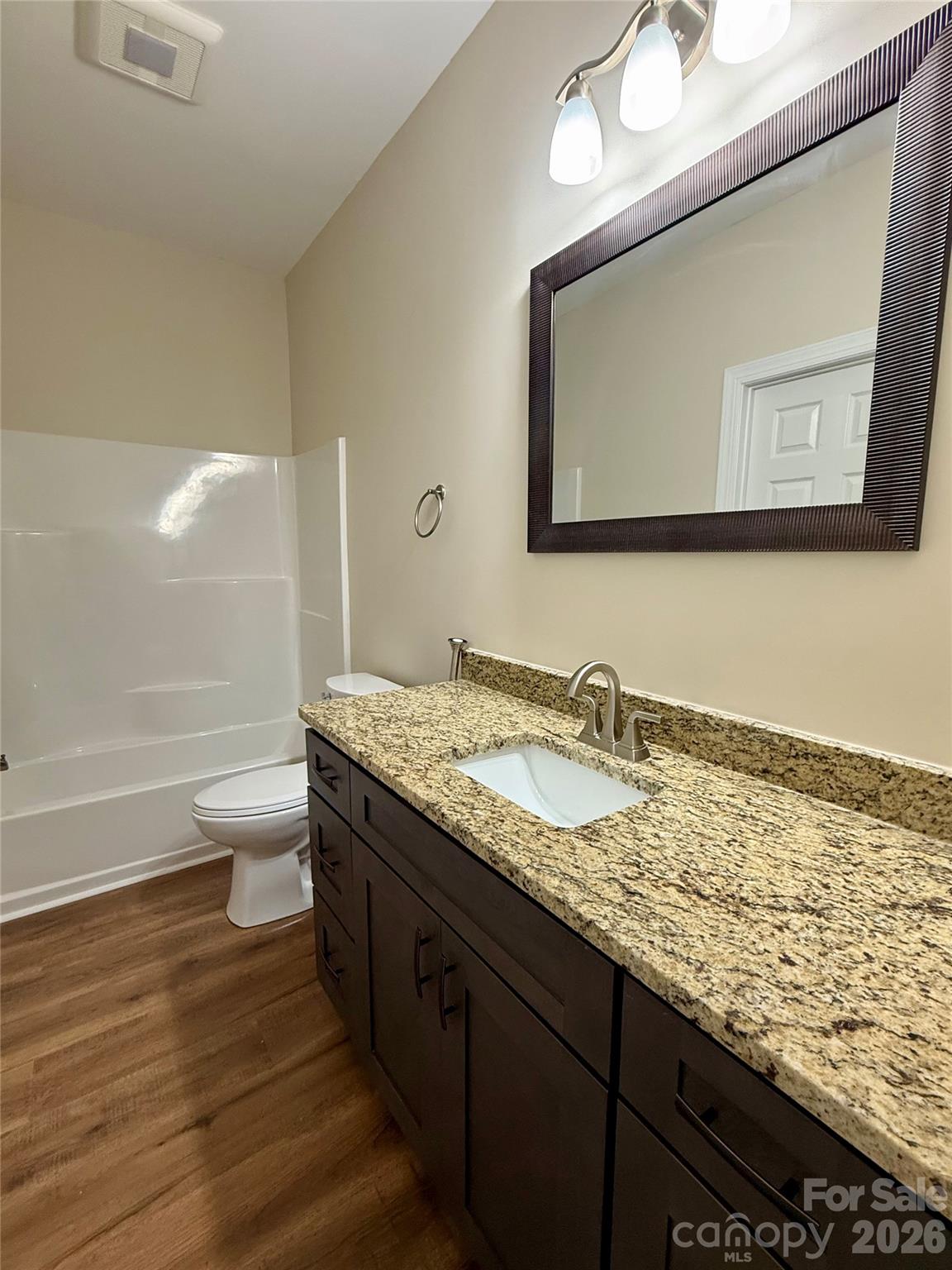 341 Broad Drive Southwest Concord, NC 28025 - Photo 12 of 16 a bathroom with a granite countertop sink and a mirror