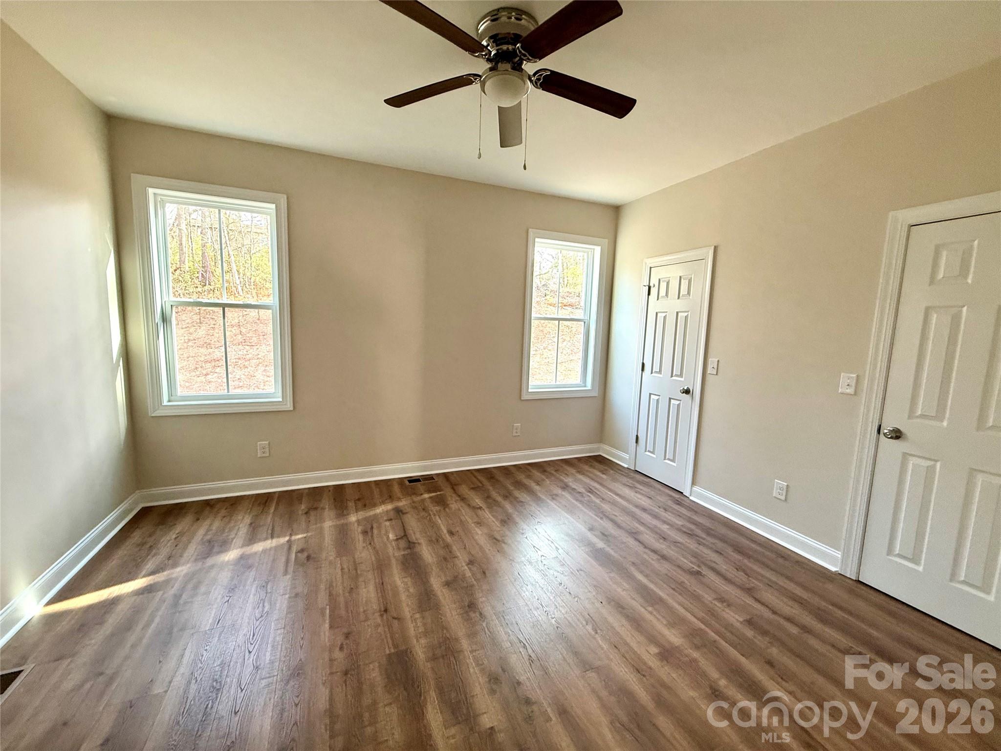 341 Broad Drive Southwest Concord, NC 28025 - Photo 14 of 16 a view of an empty room with wooden floor and a window
