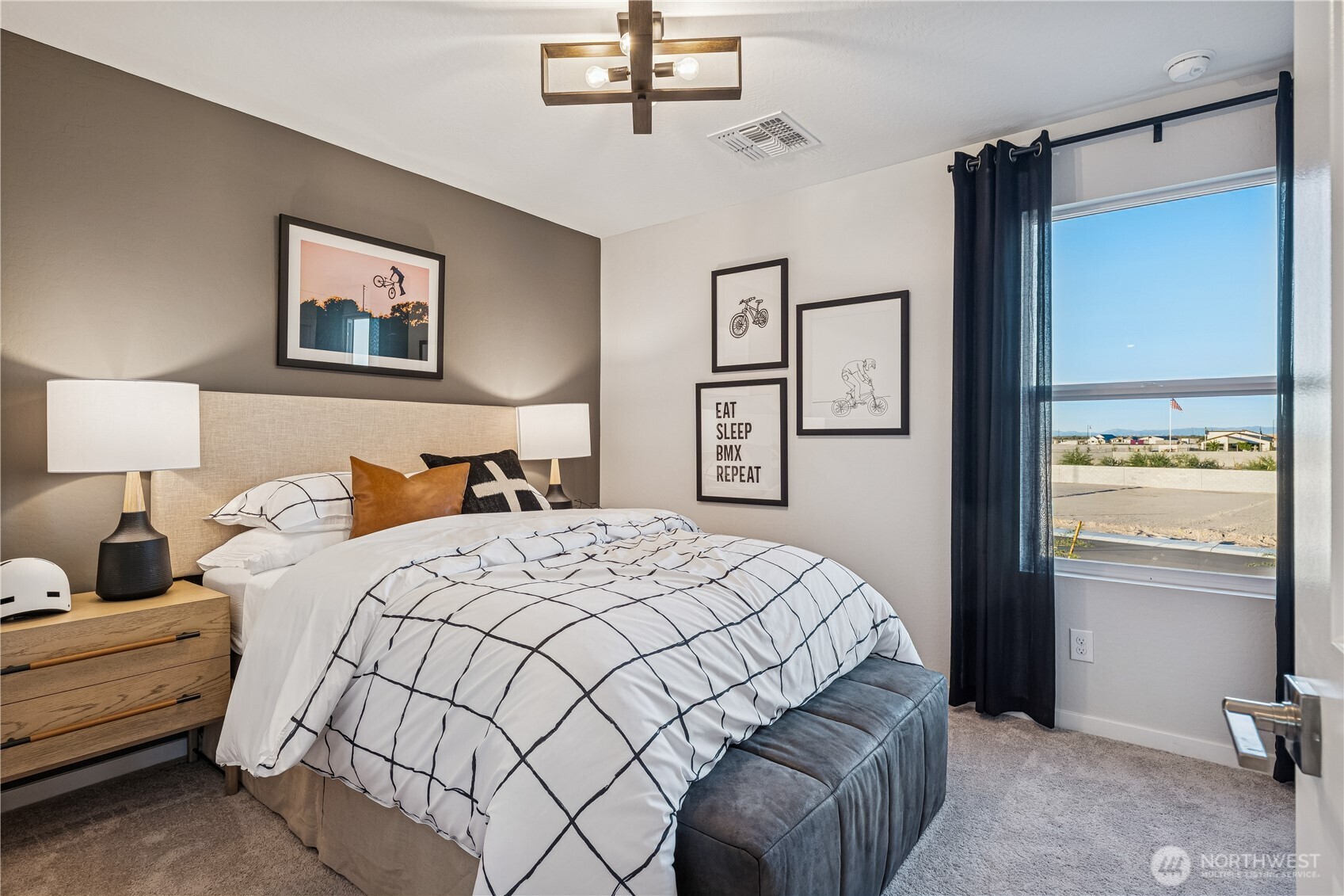 9816 Ferns Loop Southeast Yelm, WA 98597 - Photo 12 of 20 a bedroom with a bed and a lamp