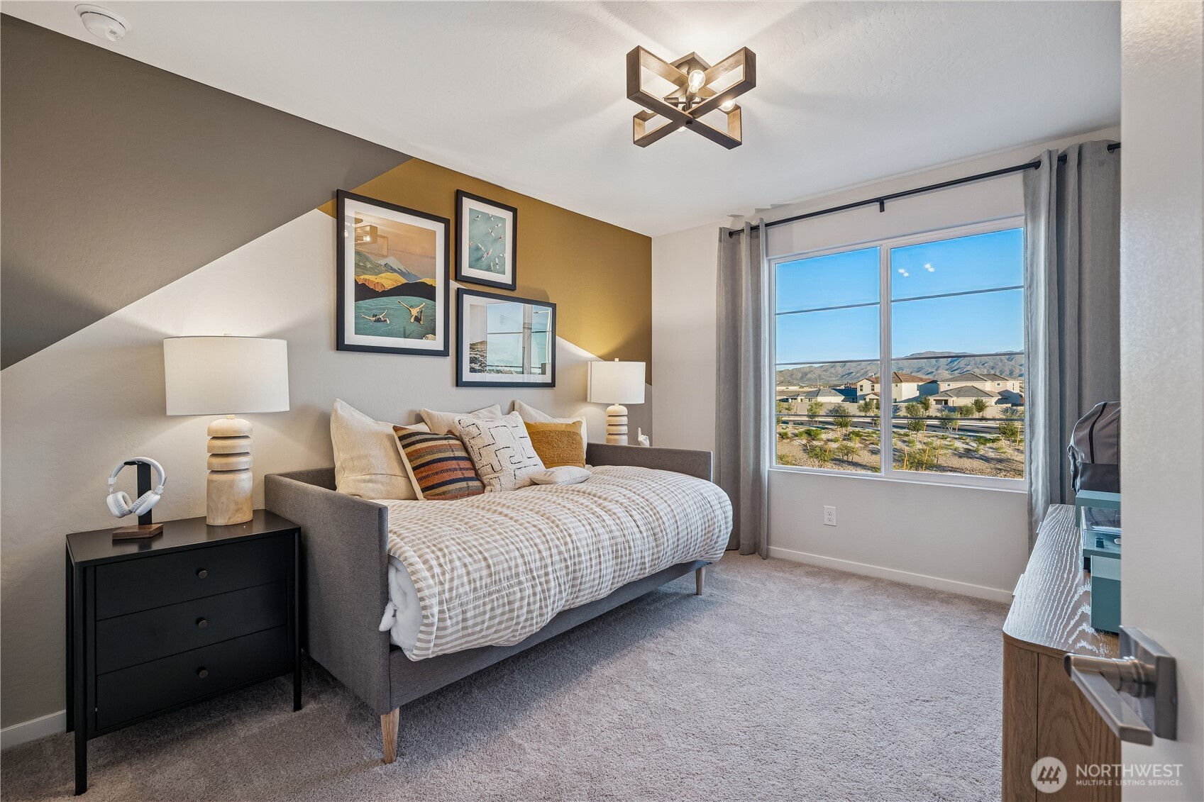 9816 Ferns Loop Southeast Yelm, WA 98597 - Photo 14 of 20 a spacious bedroom with a bed and a window