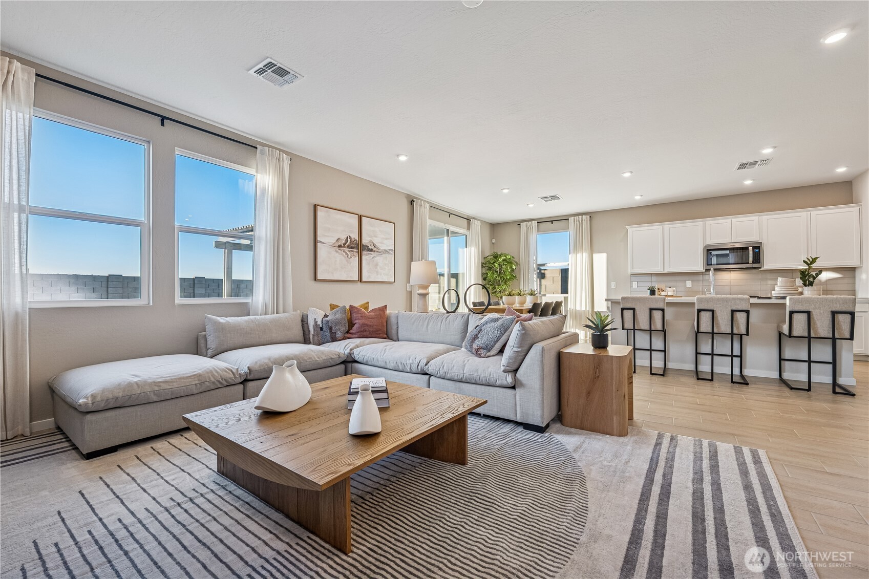 9816 Ferns Loop Southeast Yelm, WA 98597 - Photo 2 of 20 a living room with furniture and view of kitchen