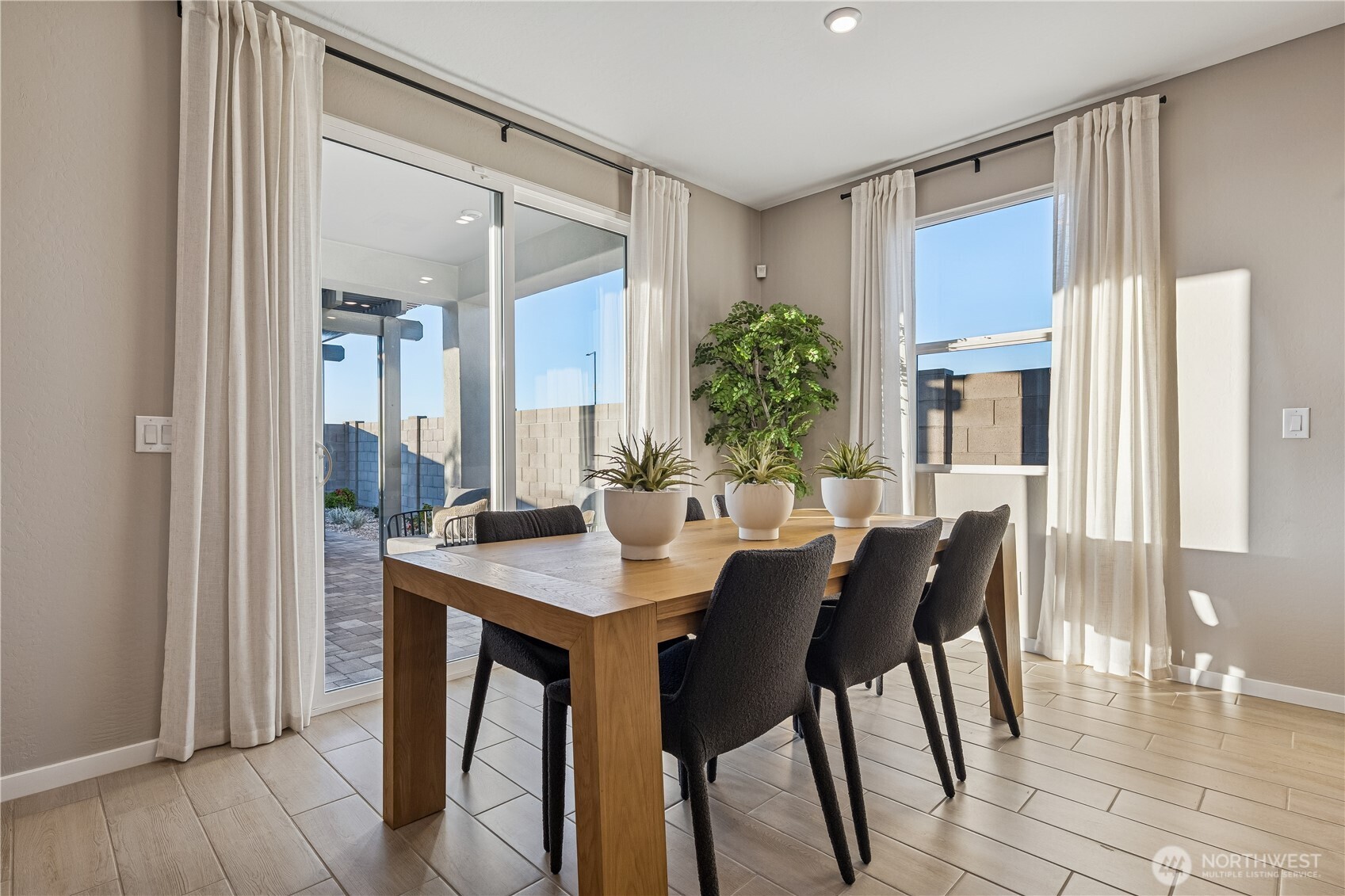 9816 Ferns Loop Southeast Yelm, WA 98597 - Photo 4 of 20 a view of a dining room with furniture and window