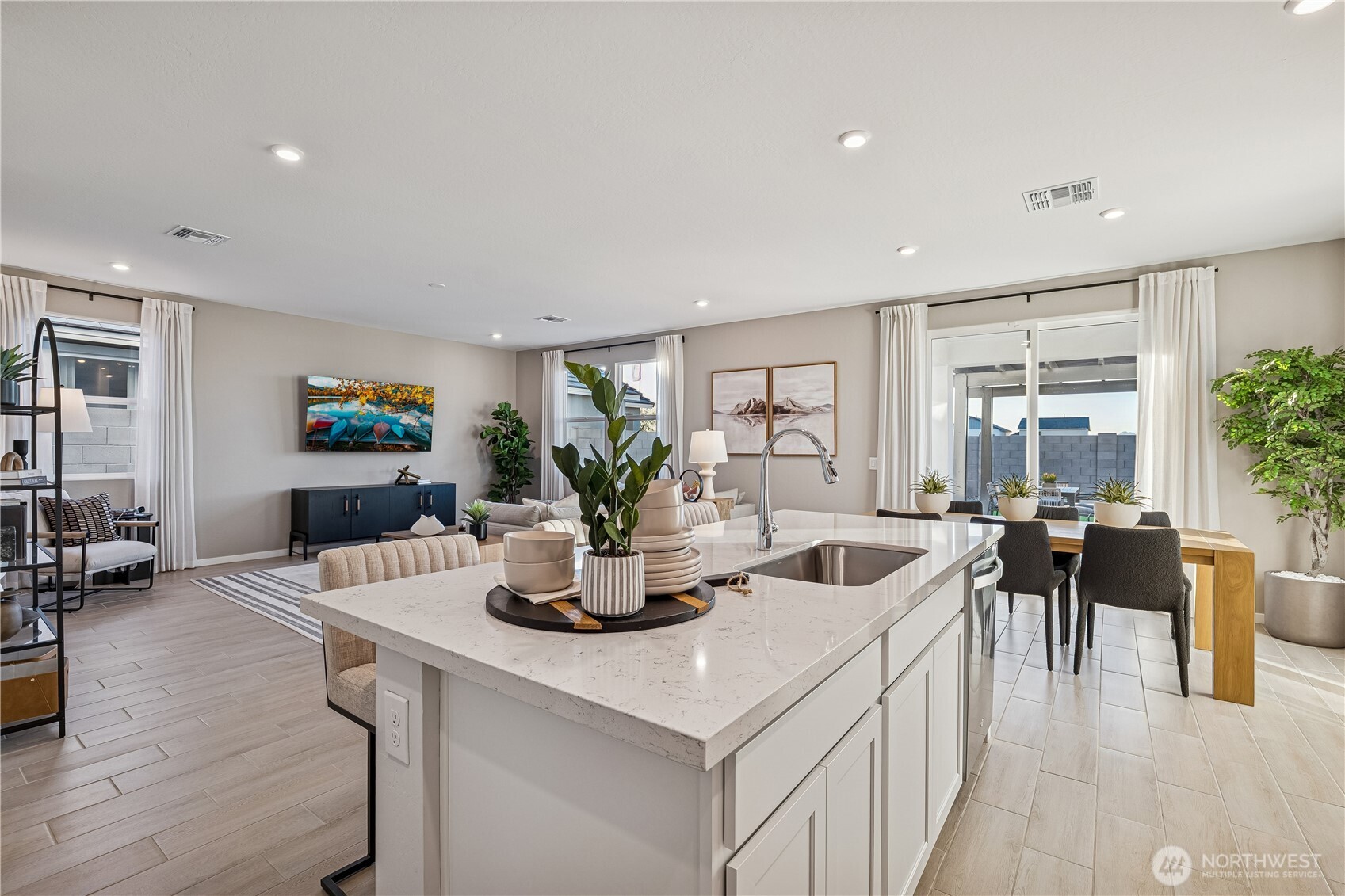 9816 Ferns Loop Southeast Yelm, WA 98597 - Photo 5 of 20 a view of a dining room with furniture and wooden floor