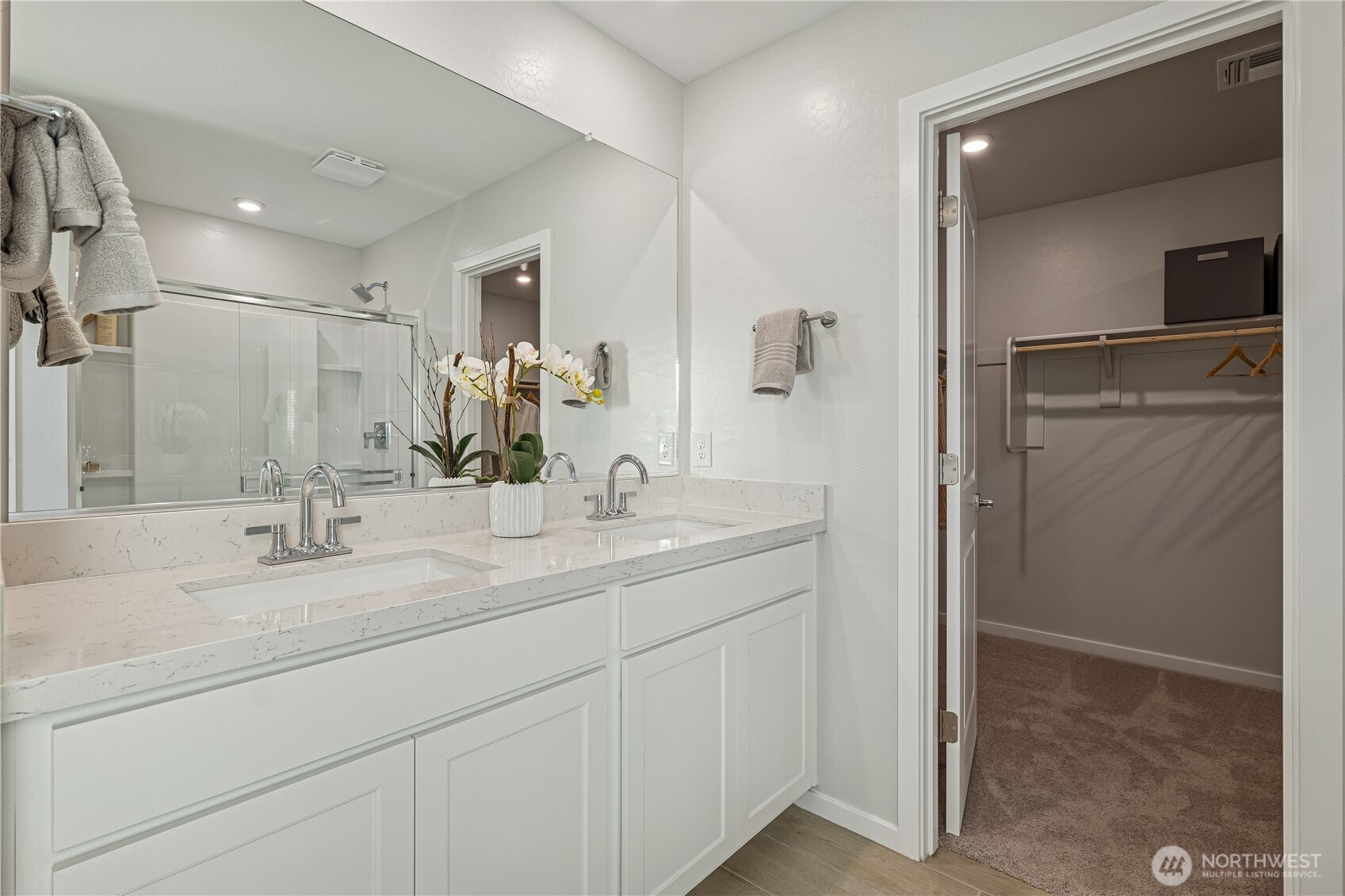 9816 Ferns Loop Southeast Yelm, WA 98597 - Photo 8 of 20 a bathroom with a double vanity sink and mirror