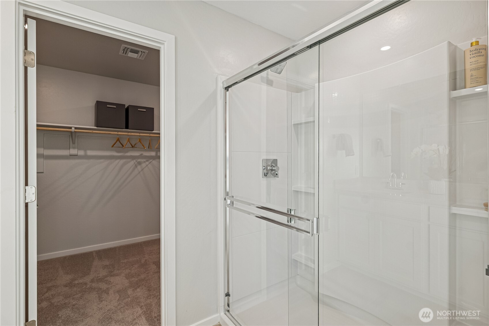 9816 Ferns Loop Southeast Yelm, WA 98597 - Photo 9 of 20 a bathroom with a shower and a glass door