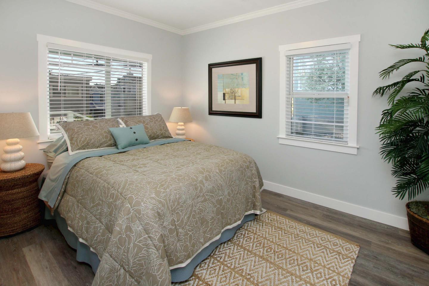 208 Cherry Avenue Capitola, CA 95010 - Photo 12 of 30 a bed sitting in a bedroom next to a window