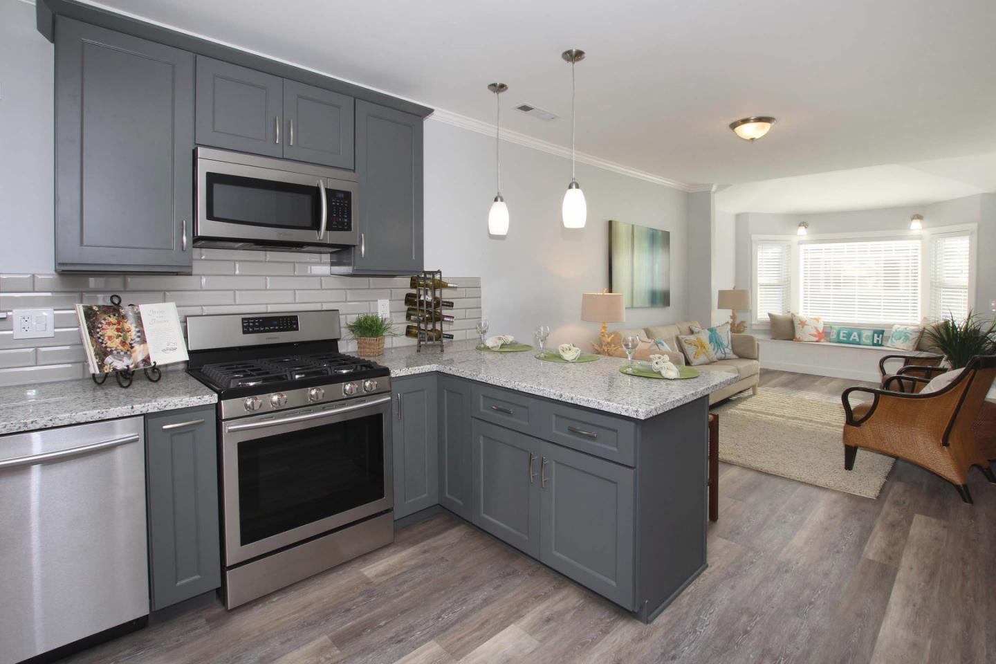 208 Cherry Avenue Capitola, CA 95010 - Photo 7 of 30 a kitchen with a sink stove and microwave