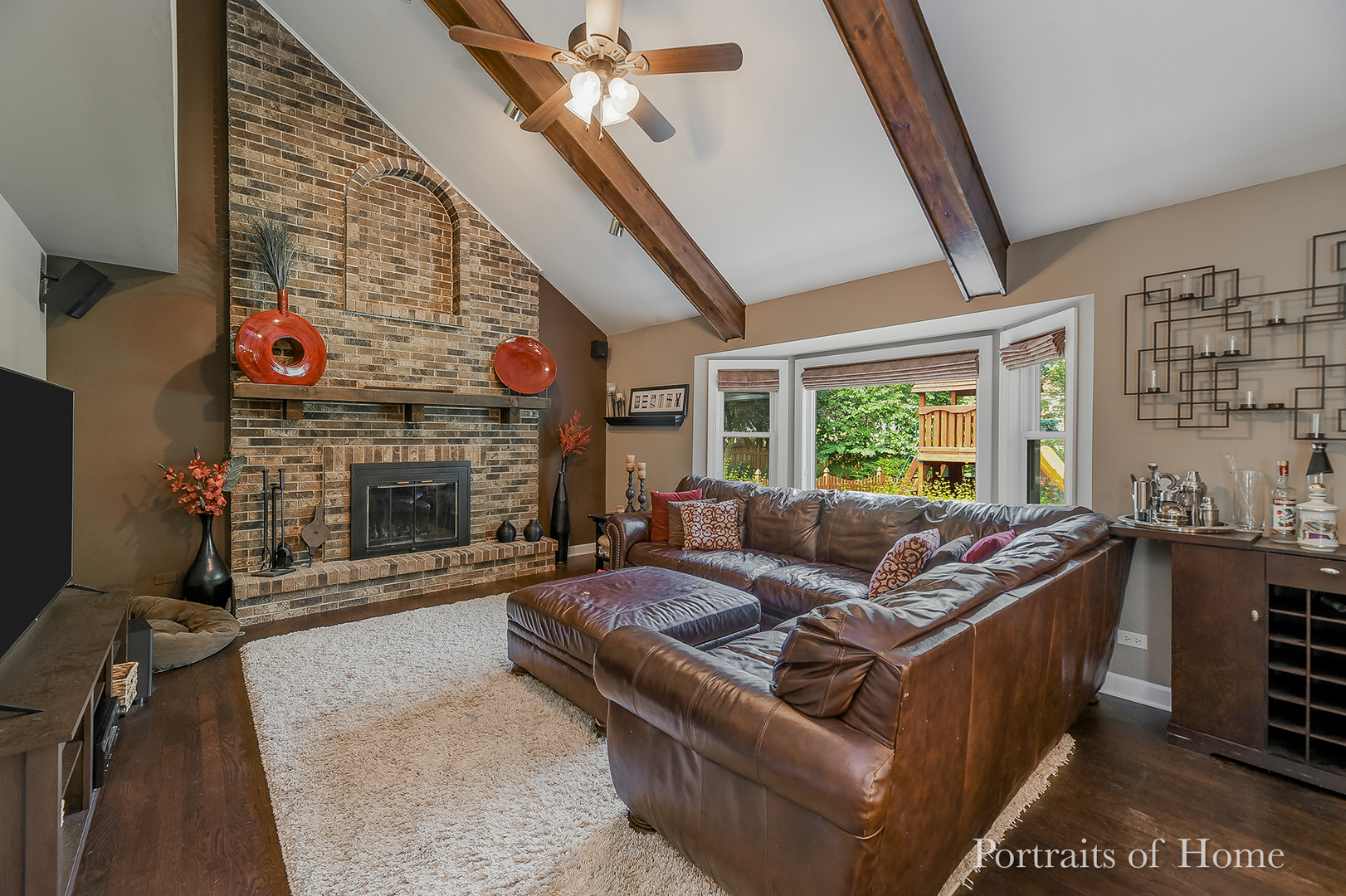 1803 Denison Road Naperville, IL 60565 - Photo 9 of 24 a living room with furniture a fireplace and a large window