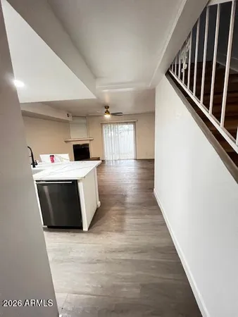 a view of kitchen with wooden floor and electronic appliances