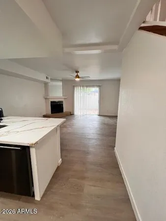 a view of a kitchen cabinets and wooden floor