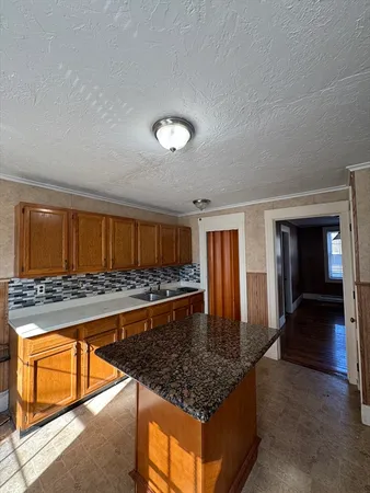 a living room with furniture a flat screen tv and a table