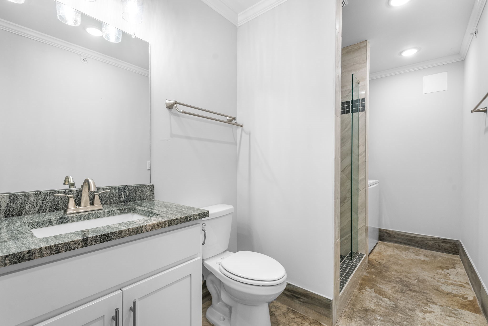 638 Madison Street, Unit 6 Clarksville, TN 37040 - Photo 17 of 25 a bathroom with a granite countertop sink toilet and a mirror