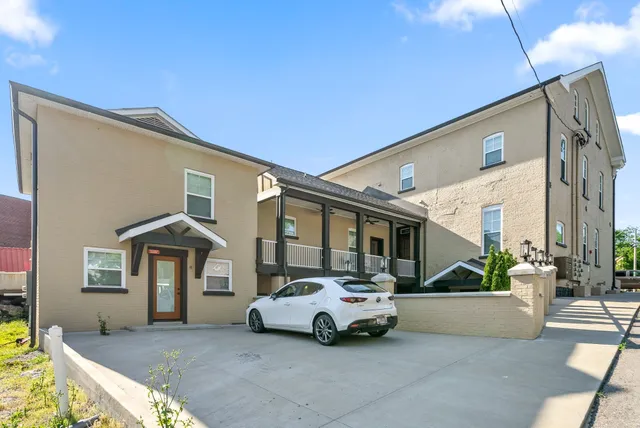 a view of car parked in front of house